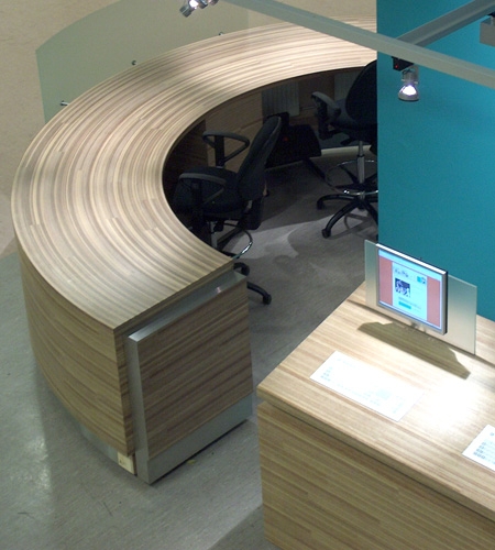 Plexwood® Van Hall Larenstein University curved top and front detail of the meranti glued-up plywood information desk