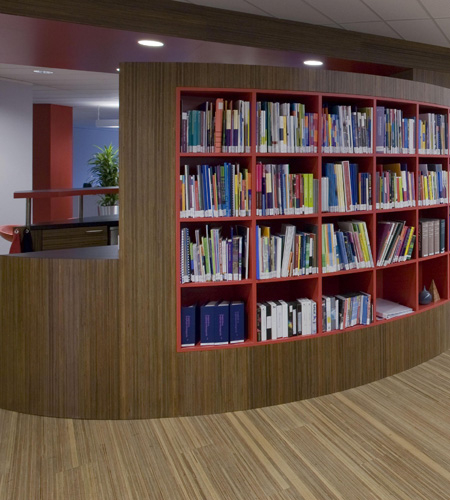 Plexwood® Child Services detail of a coffee bar in meranti curved comprised veneer plywood paneling