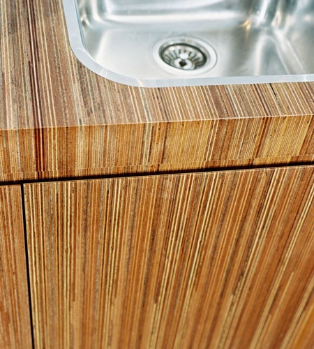 Plexwood® Consultancy Firm kitchen top with sink detail in meranti re-clamped and sliced plywood veneer