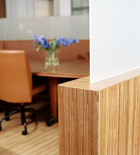 Plexwood® Consultancy Firm round wall edge detail in meranti vertical cut plywood