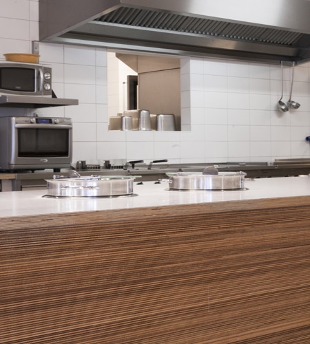 Plexwood® De Beerendonk Nursing House professional kitchen counter front in meranti maltese stacked plywood