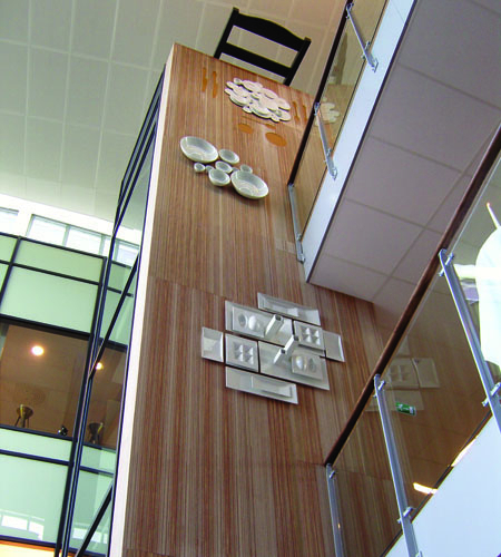 Plexwood® Måltidets Hus charming elevator hoistway exterior feature wall in meranti topsy-turvy plywood