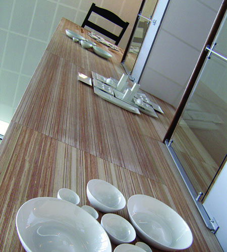 Plexwood® Måltidets Hus cnc routed elevator hoistway wall in meranti veneer of turned around plywood edges