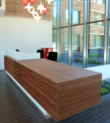 Plexwood® Parnassia central hallway reception desk in meranti architectonical veneer ply paneling