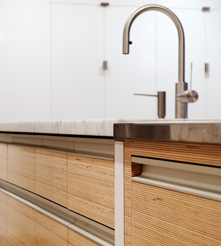 Plexwood® Kitchen detail with drawer in birch vertically sliced-up plywood strip veneer