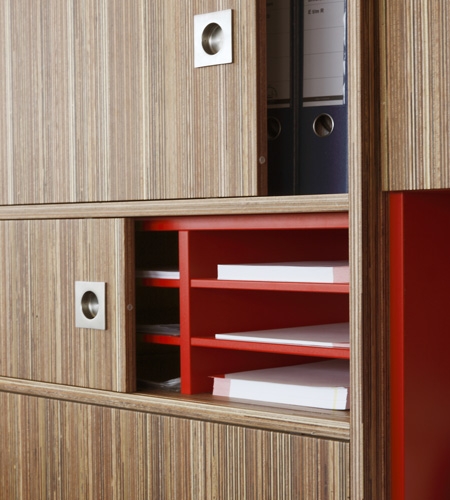 Plexwood® Rutges storage cabinet detail in comprised meranti plywood surface veneer and red HPL