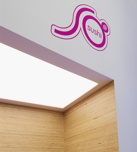 Plexwood® SoSushi wall detail with ceiling light in birch re-surfaced plywood strip panels