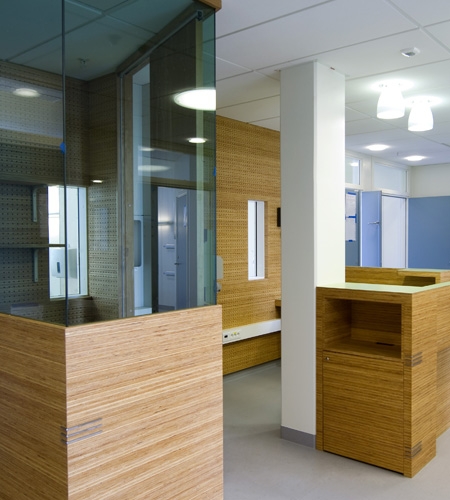 Plexwood® St. Olav's standing desk detail with storage cabinet of pine engineered micro-edge veneer panels