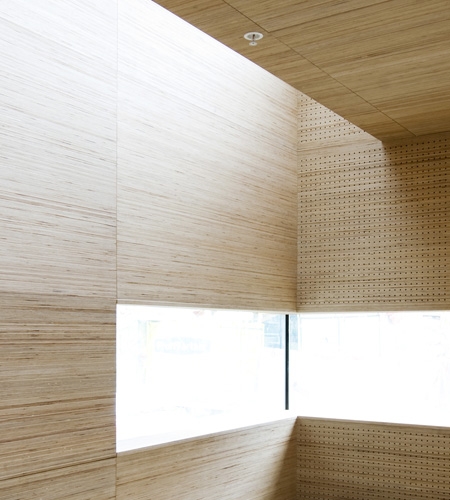 Plexwood® St. Olav's acoustic wall ceiling detail with window in reversed sandwich glued composite plywood veneer