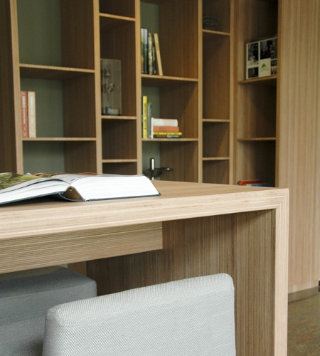 Plexwood® Tree Nursery Van den Berk detail of table with bookcases in reconstructed edged plywood veneer