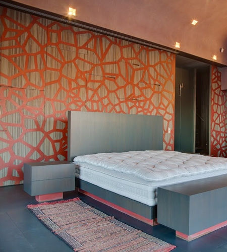 Plexwood® Residential bedroom back wall cladding and cabinetry in meranti with copper ornamentation
