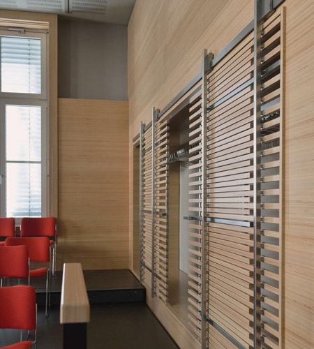 Plexwood® WBG Erfurt detail of feature wall cladding with semi-transparant slider doors in beech short edge ply