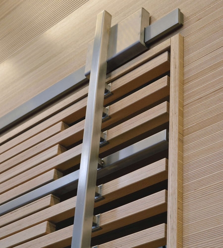Plexwood® WBG Erfurt detail of feature wall cladding with wardrobe slider door in beech engineered edge-grain plywood