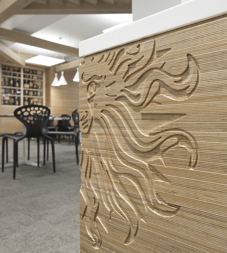 Plexwood® Publicis on Baker Street office, reception desk area with cnc-cut company logo decoration