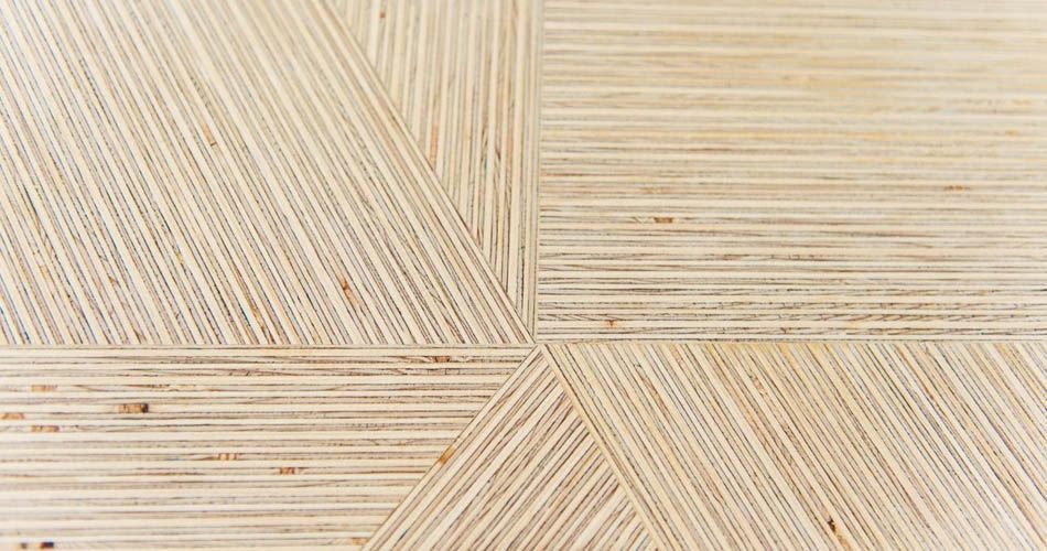 Plexwood® Deuvel design table surface detail with solid engineered deal geometric formed pattern