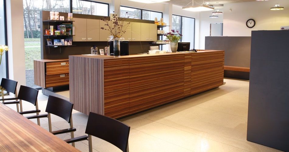 Plexwood® Pet Veterinary Deventer information desk and chester drawer in meranti quatersawn plywood veneer