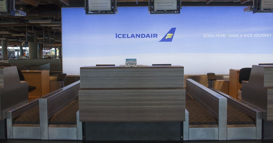 Plexwood® Iceland Air Keflavik airport check-in desk frontal in natural meranti veneer on fire- retardant safety mdf
