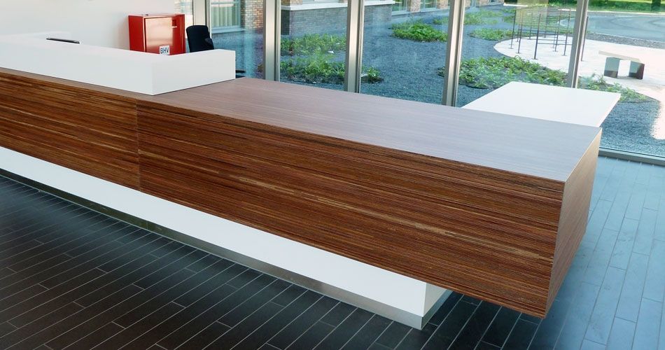 Plexwood® Parnassia, Institute for Mental Health reception desk in meranti modified composite veneer