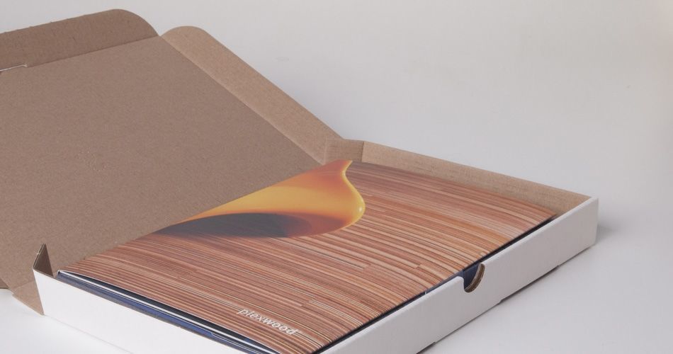 Plexwood® A blue sample box containing a hand sample in all kinds of wood and brochures