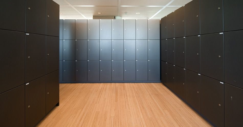 Plexwood® Tax Office and Border Security floor detail in locker room in beech parquet contrariwise glued-up plywood