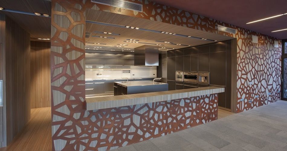 Plexwood® Hallway doors, floor and ceiling with an open kitchen counter in meranti and copper feature wall