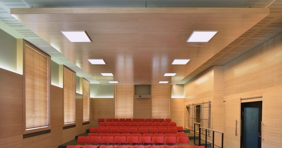 Plexwood® WBG Erfurt wall coverings with transparant slider doors and ceiling islands with integrated lights in beech