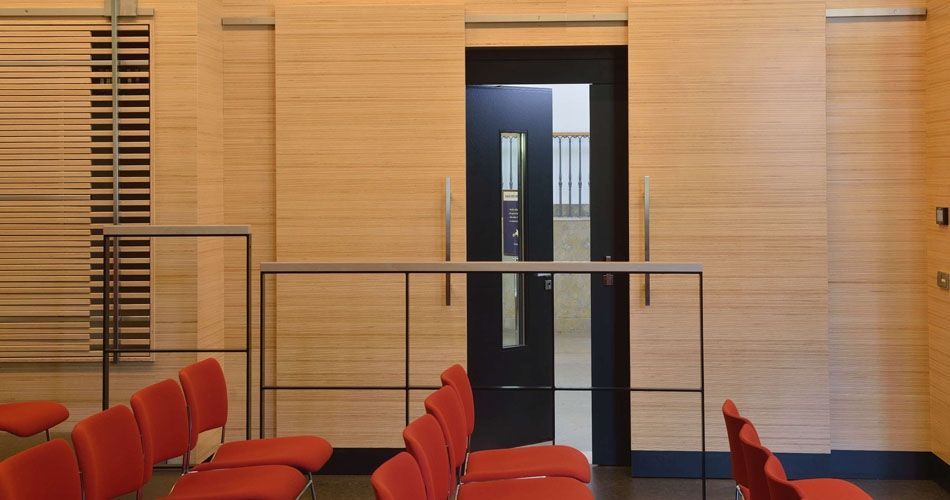 Plexwood® WBG Erfurt presentation hall room wall cladding, slider doors and semi-transparant feature wardrobe doors